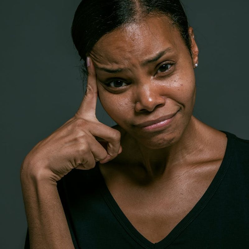 Close-up of a person's hands in a meditative pose, conveying concentration.